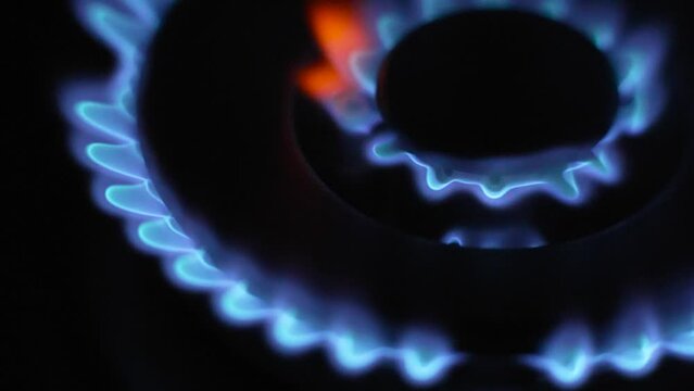 Ignite gas stove top in slow motion, Top Side view Closeup