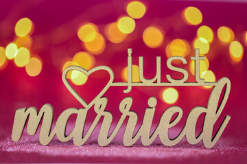 just married inscription on a pink fuchsia background .wedding symbol.Holiday of love and family