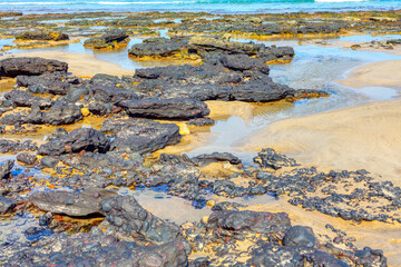 Volcanic rocks by the ocean . Coast Of Atlantic Ocean 
