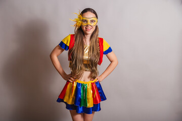 Beautiful Brazilian, Caucasian woman, wearing frevo, carnival clothes, wearing a mask. Hands on...