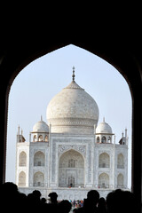 Fototapeta na wymiar Silhouette of People at Taj Mahal, India. Visitors all over the world visiting the beautiful Taj Mahal in Uttar Pradesh, India. Wonders of the world. 