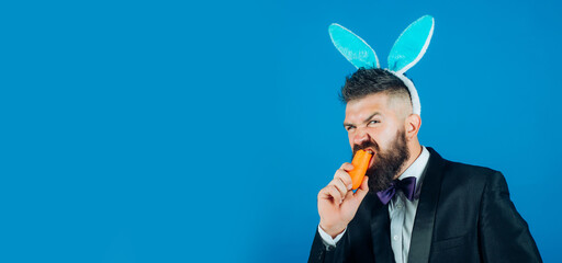 Happy easter egg. Smile easter man. Man in suit with bunny rabbit ears. Easter bunny dress. Horizontal photo banner for website header design.
