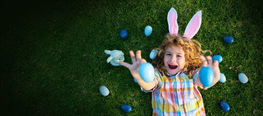 Child hunt egg in garden on Easter day. Easter banner, mockup copy space, poster flyer header for website template. Top view funny kids face.