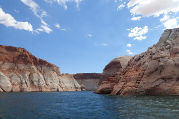 Fototapeta na wymiar Colorful sandstone rock formations along the Colorado River at Glen Canyon National Recreation Area