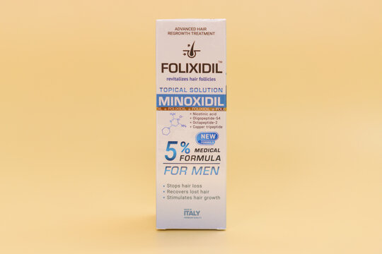 Milan, Italy - Jun 25, 2022: Folixidil minoxidil medicine for hair growth  in a package on orange background. Hairstyle. Science. Serum. Man. Adult.  Beauty. Hair Loss. Bald. Cosmetic. Damage. Grow Photos | Adobe Stock