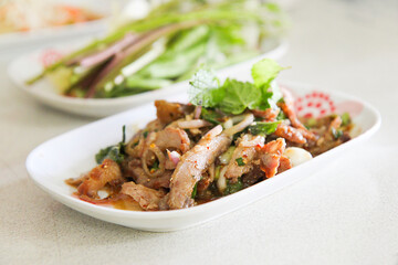 Thai food spicy grilled Pork salad serve with fresh vegetables, Thai food, selective focus
