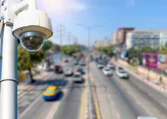 Road traffic control cctv security cameras with blur traffic background.