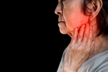 Fototapeta premium Inflammation at the jaw of Asian patient. She feels wisdom toothache and lymph node pain.
