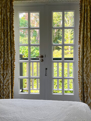 Window with beautiful view on garden in cozy room. Interior design