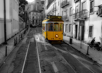 Fototapeta na wymiar Black and white background of the yellow street car on the streets of Lisbon, Portugal