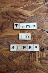 time to sleep text on wooden square, business quotes