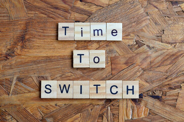 Time to switch text on wooden square, business inspiration quotes