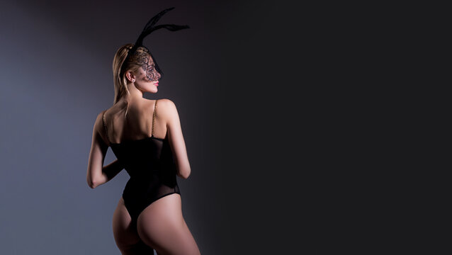 Naked bunny woman, fashion rabbit. Hot girl. Luxury ass. Stockings. Sexy game costume. Girl in sexy black lingerie and stockings. Wide photo banner for website header design.