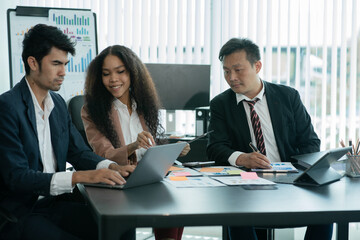 Group of asian business people working, discussing new projects together, having fun at the office.