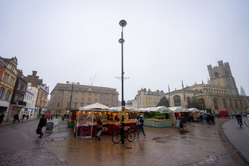 Cambridge Market Square , historic market square outdoor gourmet food stalls in old towns during winter snow at Cambridge , United Kingdom : 3 March 2018