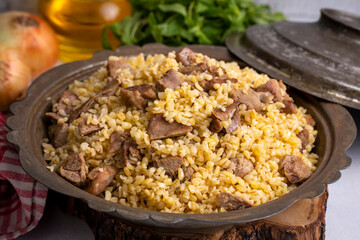 From traditional delicious Turkish cuisine; Bulgur pilaf with meat (Turkish name; etli bulgur pilavi)