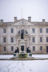 King's College Cambridge , Front Court and Gibbs Buildings during winter snow at Cambridge , United Kingdom : 3 March 2018
