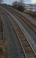 Fototapeta na wymiar Two sets of railraod tracks curving left