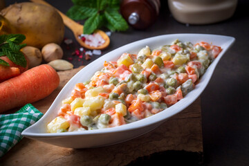 Russian salad Olivier with mayonnaise and egg served (Turkish name; Rus salatasi)