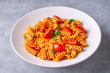 Fusilli pasta, spiral or spirali pasta with tomato sauce - Italian food style (Turkish name; domatesli, domates soslu burgu makarna)