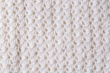 Knitted texture. Pattern fabric made of wool. Background, copy space. Handmade sweater texture, knitted wool pattern