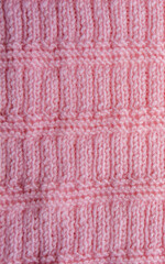 Fototapeta premium Knitted texture. Pattern fabric made of wool. Background, copy space. Handmade sweater texture, knitted wool pattern