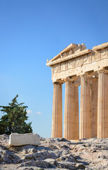 View of part of the Acropolis of Athens against the blue sky in Athens