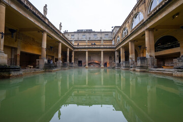 Naklejka premium The Roman Bath , well preserved Roman thermae in old town of Bath during winter cloudy day in Bath , United Kingdom : 5 March 2018