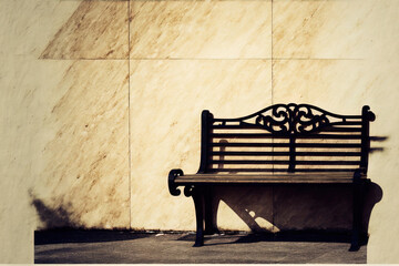 Unoccupied metal and wood bench next to beige marble wall. Background of one bench against a stone wall, up close, with copy space. Generative AI