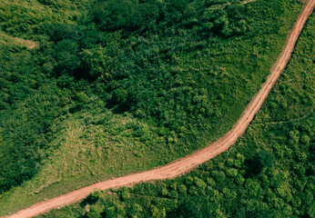 Road in the middle of the forest , road curve construction up to mountain, Rainforest ecosystem and healthy environment concept	