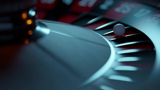 Close up of roulette wheel at the casino in motion. The wheel ball is spinning. Concept of casino and gambling.