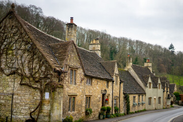 Fototapeta na wymiar Castle Combe , Beautiful village in Cotwolds with old stone houses bridge and river during winter in Wiltshire , United Kingdom : 6 March 2018