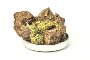 Dried marijuana, glass jar lid on white background. Medical marijuana dispensary Alternative medicine Cannabis plantation for medical and business concept.