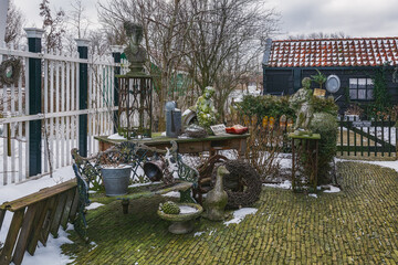 A small warehouse of old garden decorations in the courtyard of the house.