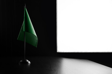 Small national flag of the Arab League on a black background
