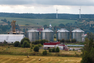 aerial view on agro-industrial complex with silos and grain drying line