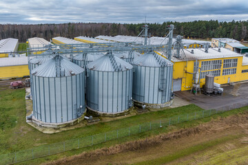 aerial view on agro-industrial complex with silos and grain drying line