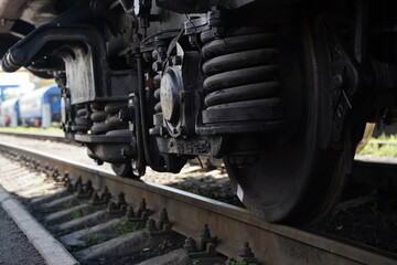 Almaty, Kazakhstan - 05.20.2022 - The wheels of the passenger train on the rails at the terminal station.