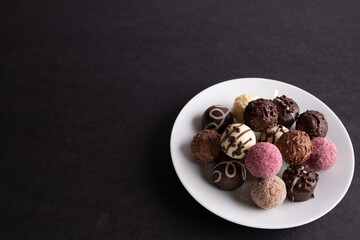 photo round chocolate sweets in a plate