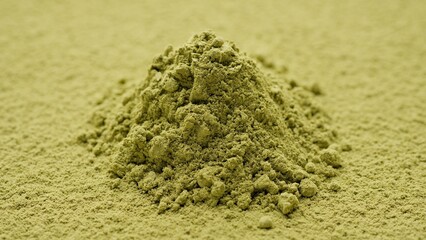 Heap of matcha green tea powder. Healthy drinks concept