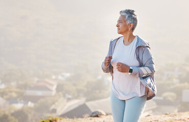Running, mature woman and fitness on mountains, nature background and exercise for healthy goals,...