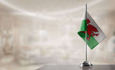 A small Wales flag on an abstract blurry background