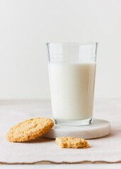 Glass of fresh milk with oatmeal cookies