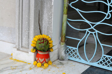The Hindu auspicious element of the ritual is the pot, the coconut and the swastika.