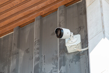 Wall mounted modern IP CCTV security camera. Home and workplace security concept