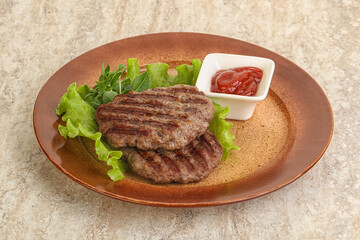 Grilled beef burger cutlet with sauce