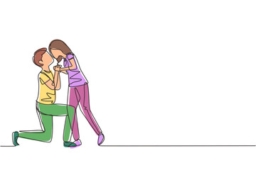 Single one line drawing romantic male kneel and kissing female. Couple lovers kissing and holding hands. Happy man and woman celebrating wedding anniversary. Modern continuous line draw design graphic