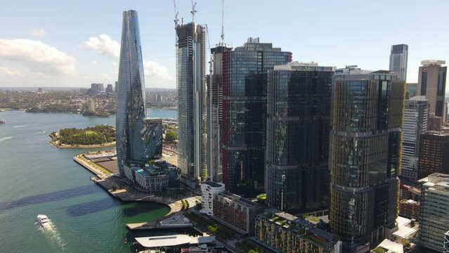 Aerial drone view of Barangaroo waterfront precinct in Sydney City, NSW looking toward Barangaroo Reserve and North Sydney on a sunny morning    