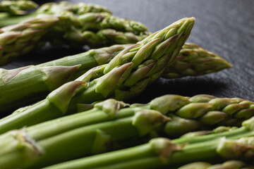 Green asparagus on a black background