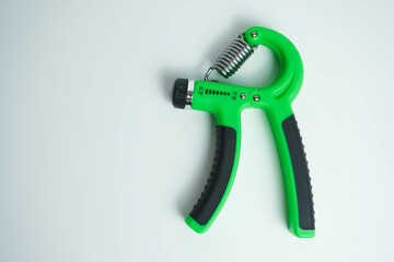 Hand grip for grip training green color isolated on white background